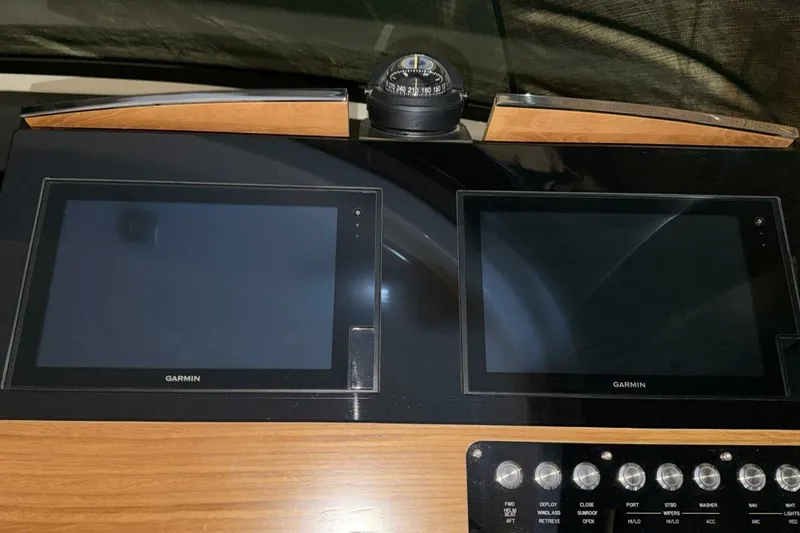 Slide: The Image of Dashboard of 2018 Tiara Yachts C44 Coupe with Garmin displays and compass. - 12