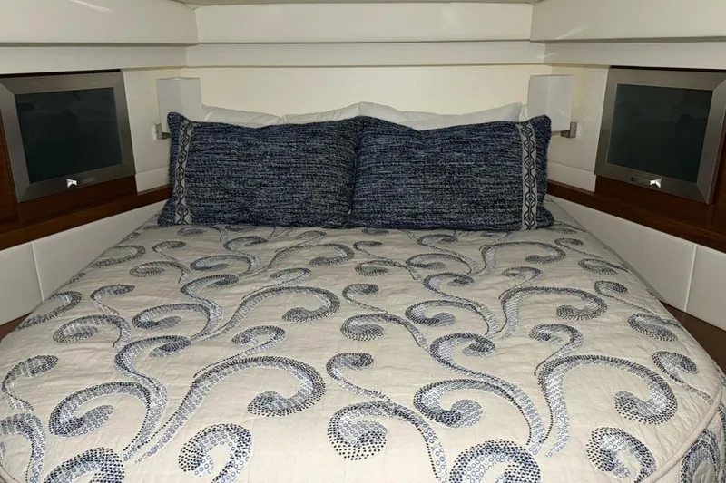 Slide: The Image of Luxurious cabin interior of 2018 Tiara Yachts C44 Coupe with elegant bedding. - 14