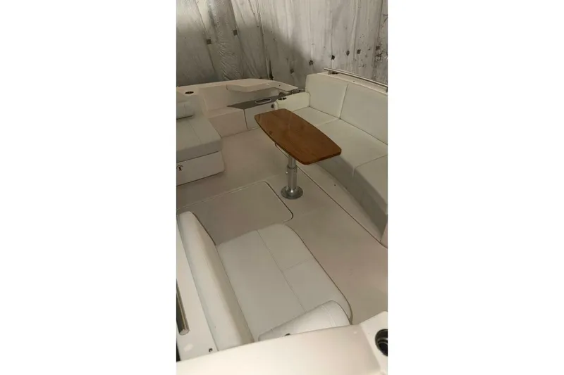 Slide: The Image of Interior of 2018 Tiara Yachts C44 Coupe with seating and wooden table. - 25