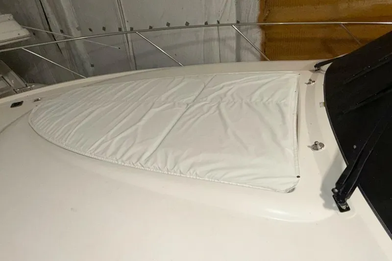 Slide: The Image of 2018 Tiara Yachts C44 Coupe with covered deck area in storage. - 27