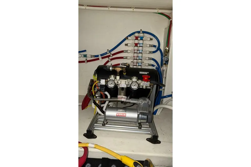 Slide: The Image of Engine room of 2018 Tiara Yachts C44 Coupe with visible machinery and wiring. - 37