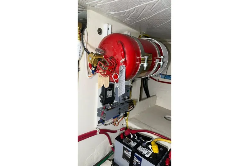 Slide: The Image of Engine room of 2018 Tiara Yachts C44 Coupe with fire suppression system. - 38