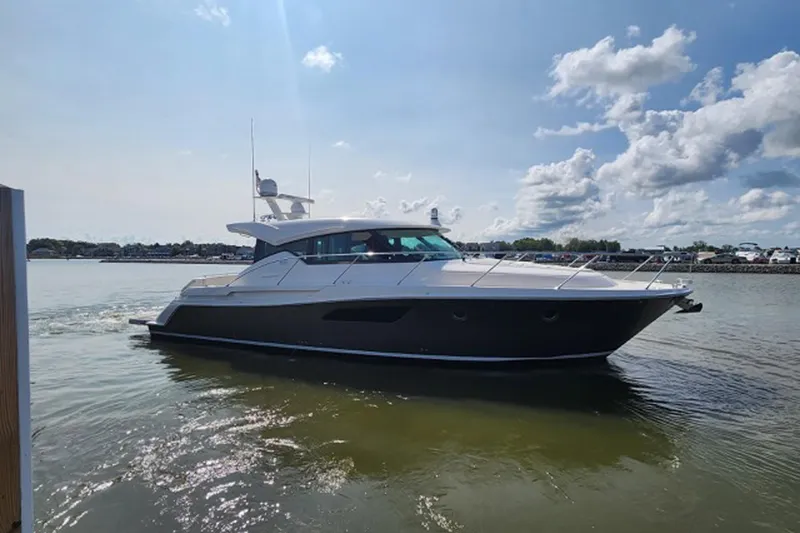 Slide: The Image of 2018 Tiara 44 Coupe yacht cruising on a sunny day. - 4