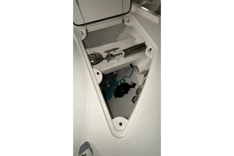 Slide: The Image of Anchor compartment of 2018 Tiara Yachts C44 Coupe, showcasing storage and equipment. - 40