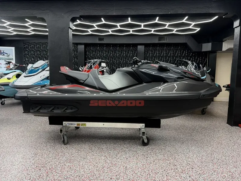 Slide: The Image of 2026 Sea-Doo GTR™-X 300 iBR jet ski in showroom. - 1