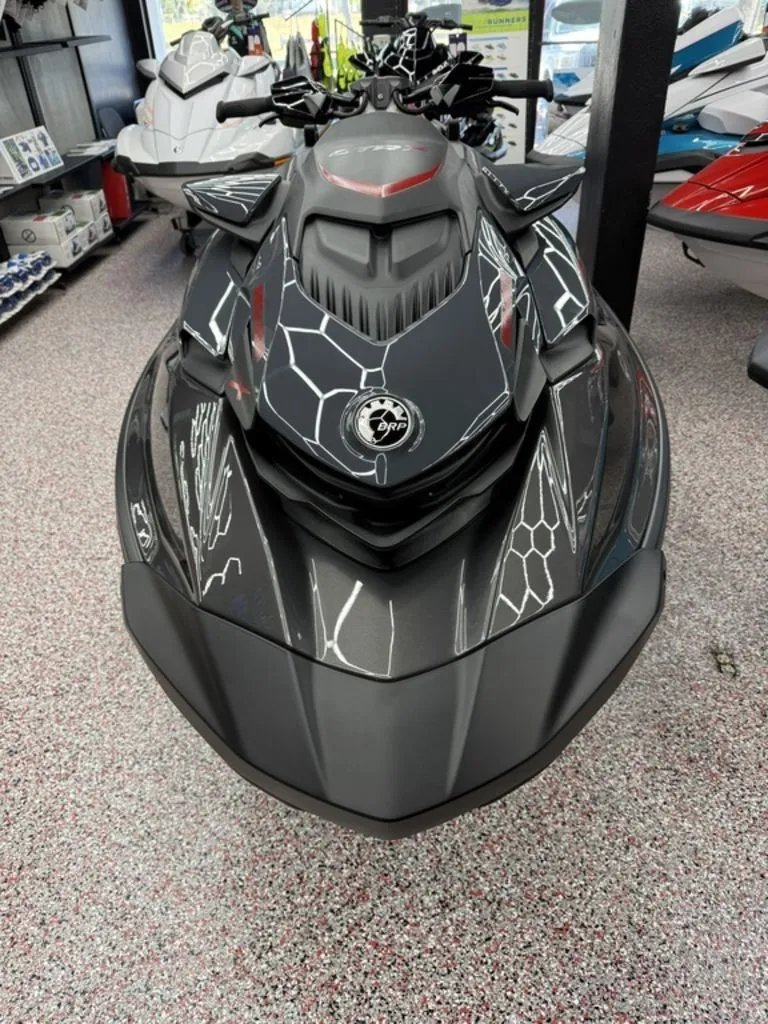 Slide: The Image of 2026 Sea-Doo GTR-X 300 iBR jet ski in a showroom. - 3