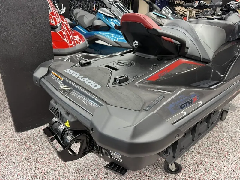 Slide: The Image of 2026 Sea-Doo GTR-X 300 iBR jet ski in a showroom. - 8