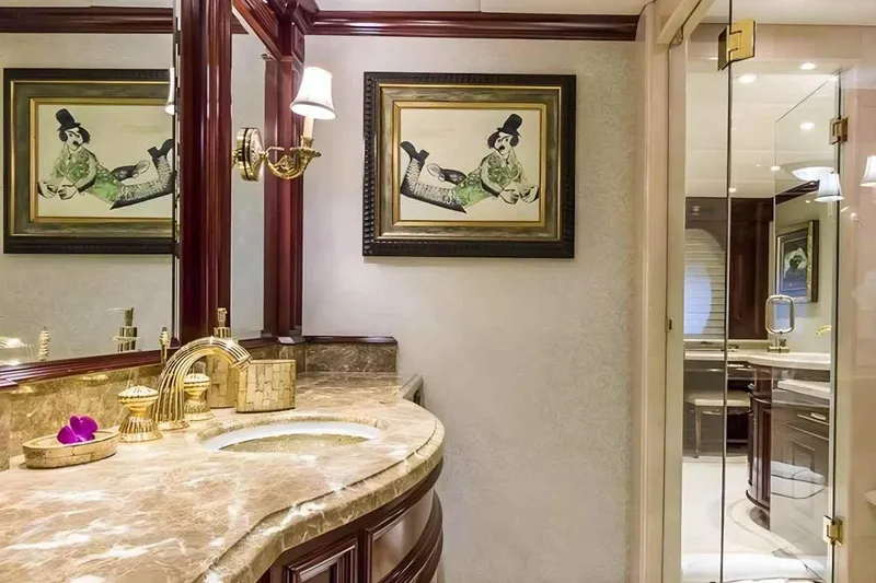 Slide: The Image of Luxurious bathroom on 2003 Trinity Yachts motoryacht with marble countertop and elegant decor. - 10