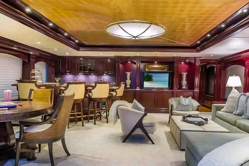 Slide: The Image of Luxurious interior of 2003 Trinity Yachts motoryacht with elegant seating and bar area. - 18