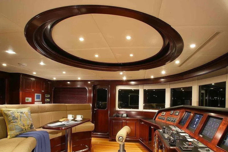 Slide: The Image of Luxurious interior of 2003 Trinity Yachts motoryacht with elegant wood finishes and modern controls. - 20