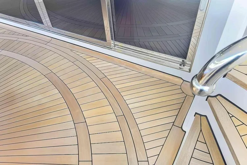 Slide: The Image of Luxurious teak deck on 2003 Trinity Yachts Motoryacht with elegant curved design. - 31