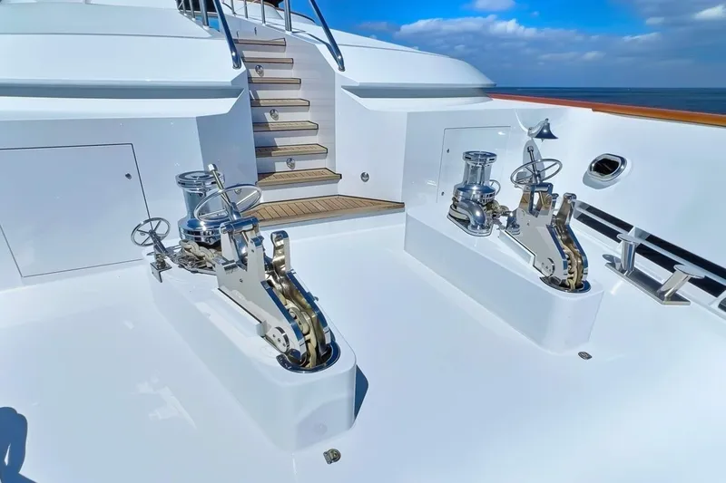 Slide: The Image of Deck of 2003 Trinity Yachts Motoryacht with winches and stairs under blue sky. - 33