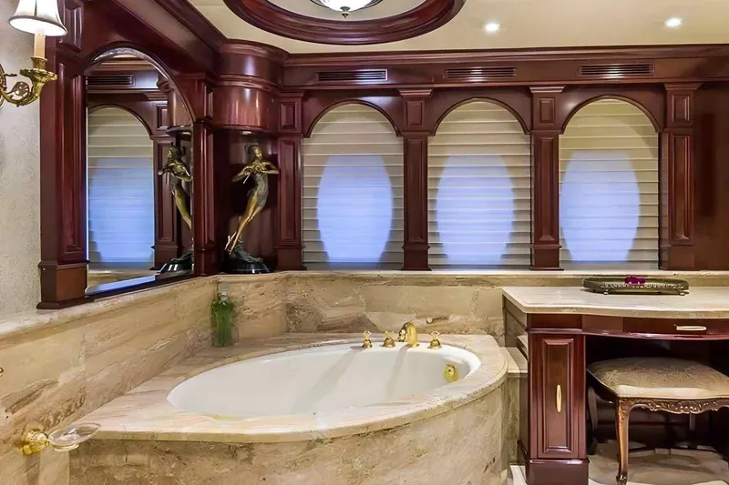 Slide: The Image of Luxurious bathroom interior on 2003 Trinity Yachts Motoryacht with elegant wood accents and marble finishes. - 9