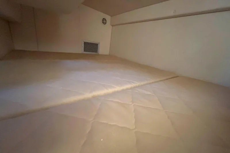 Slide: The Image of Interior cabin of 2007 Sea Ray 260 Sundancer with beige upholstery. - 17