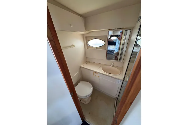 Slide: The Image of Bathroom interior of 1999 Silverton 392 Motor Yacht with shower and sink. - 15