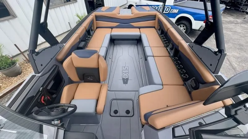 Slide: The Image of 2024 Axis A245 boat interior with tan and gray seating, modern design, and spacious layout. - 10