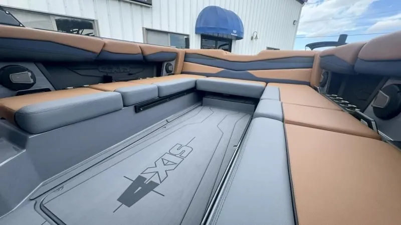 Slide: The Image of 2024 Axis A245 boat interior with tan and gray seating, showcasing spacious and modern design. - 18