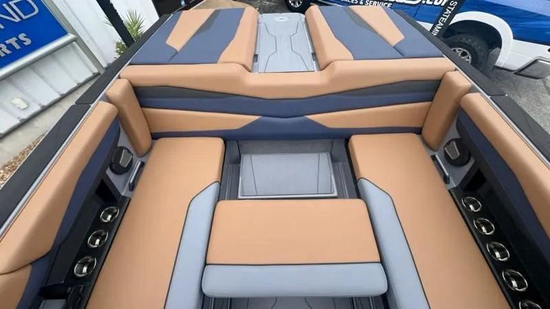 Slide: The Image of 2024 Axis A245 boat interior with tan and gray seating, showcasing modern design and comfort. - 21