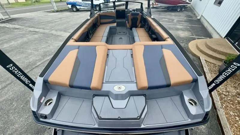 Slide: The Image of 2024 Axis A245 boat with spacious seating and modern design, parked outdoors. - 22