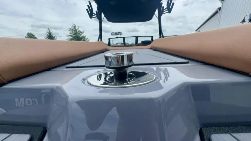 Slide: The Image of 2024 Axis A245 boat interior with brown seating and sleek design. - 23