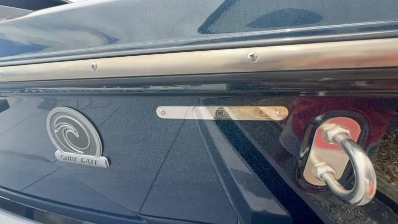 Slide: The Image of 2024 Axis A245 boat detail with Sure Gate logo and metal fittings. - 25