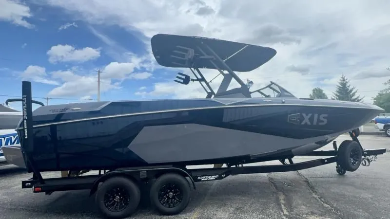 Slide: The Image of 2024 Axis A245 boat on trailer under cloudy sky. - 5