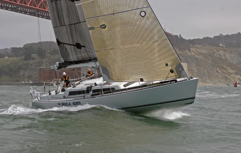 Slide: The Image of Sailing yacht Santa Cruz SC 50, 1980, under Golden Gate Bridge in choppy waters. - 10