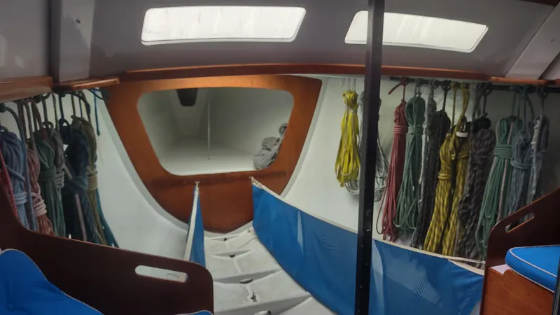 Slide: The Image of Interior of 1980 Santa Cruz SC 50 sailboat with ropes and storage. - 28