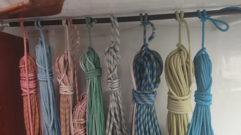 Slide: The Image of Colorful ropes neatly hung on a Santa Cruz SC 50 sailboat, 1980 model. - 32