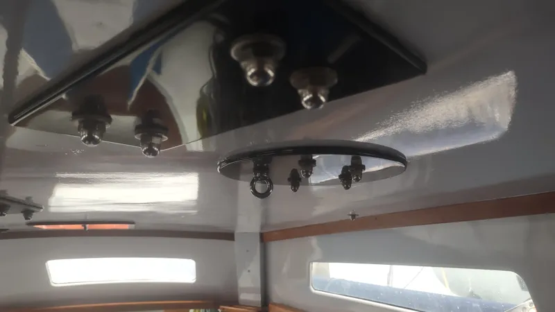 Slide: The Image of Interior view of a 1980 Santa Cruz SC 50 sailboat, showing ceiling hardware. - 39
