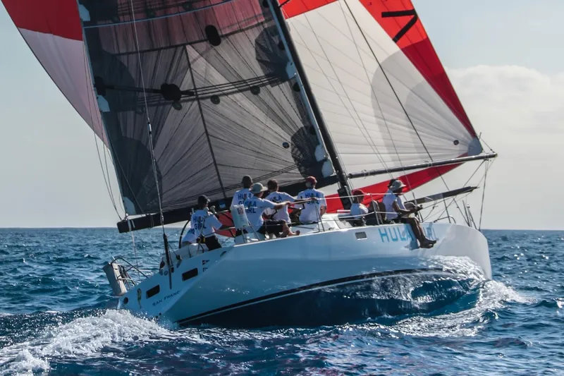 Slide: The Image of Sailing yacht Santa Cruz SC 50, 1980, with crew navigating ocean waters. - 6