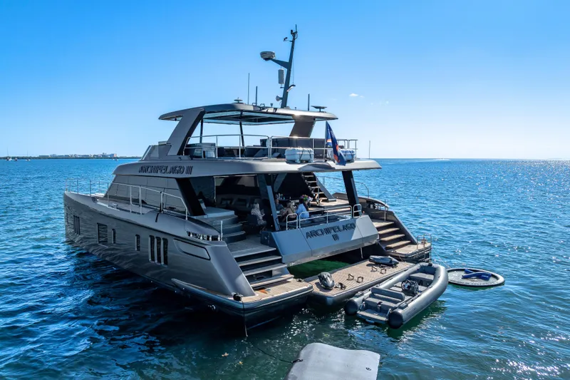 Slide: The Image of Luxurious 2026 Sunreef 60 Power yacht docked on serene blue waters. - 10