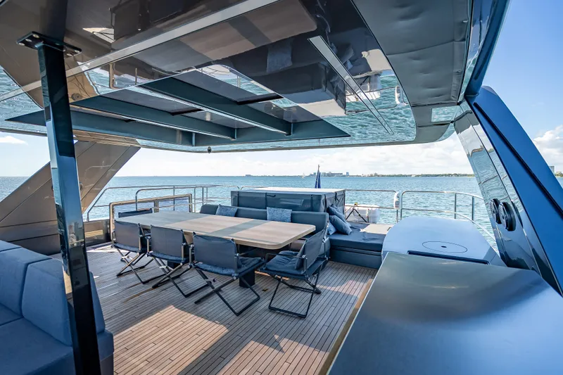 Slide: The Image of Luxurious Sunreef 60 Power yacht deck with seating, dining area, and ocean view, 2026 model. - 24