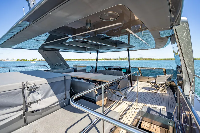 Slide: The Image of Luxurious Sunreef 60 Power yacht deck, 2026 model, featuring elegant seating and ocean views. - 30