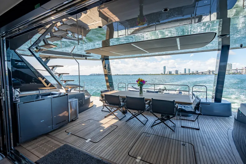 Slide: The Image of Luxurious Sunreef 60 Power yacht deck with dining area, ocean view, and modern design, 2026 model. - 36