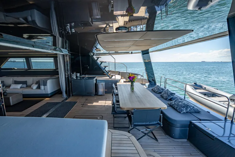 Slide: The Image of Luxurious Sunreef 60 Power yacht interior, featuring elegant seating and dining area with ocean view. - 41