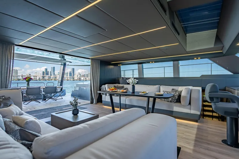 Slide: The Image of Luxurious interior of 2026 Sunreef 60 Power yacht with city skyline view. - 42