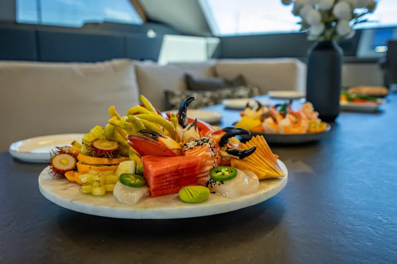 Slide: The Image of Luxurious dining setup on 2026 Sunreef 60 Power yacht with gourmet seafood platter. - 50