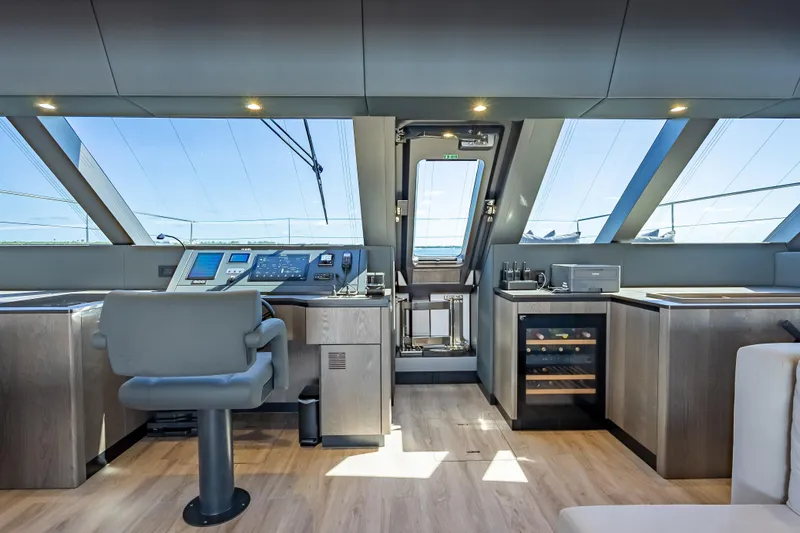 Slide: The Image of Luxurious interior of 2026 Sunreef 60 Power yacht with modern helm and panoramic windows. - 55