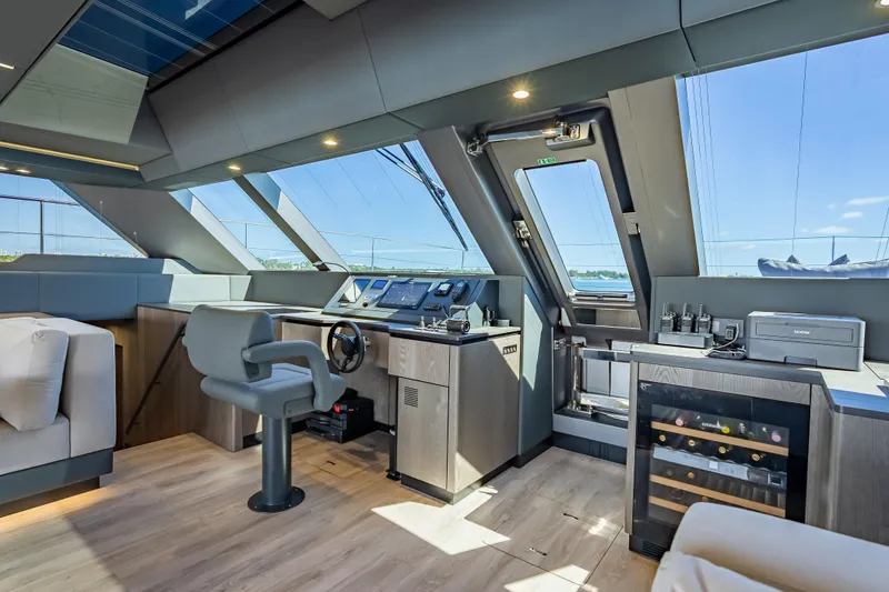 Slide: The Image of Luxurious interior of 2026 Sunreef 60 Power yacht with modern helm and panoramic windows. - 56