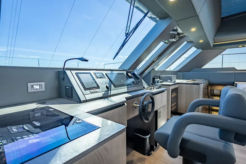 Slide: The Image of Luxurious helm of 2026 Sunreef 60 Power yacht with modern navigation equipment. - 57