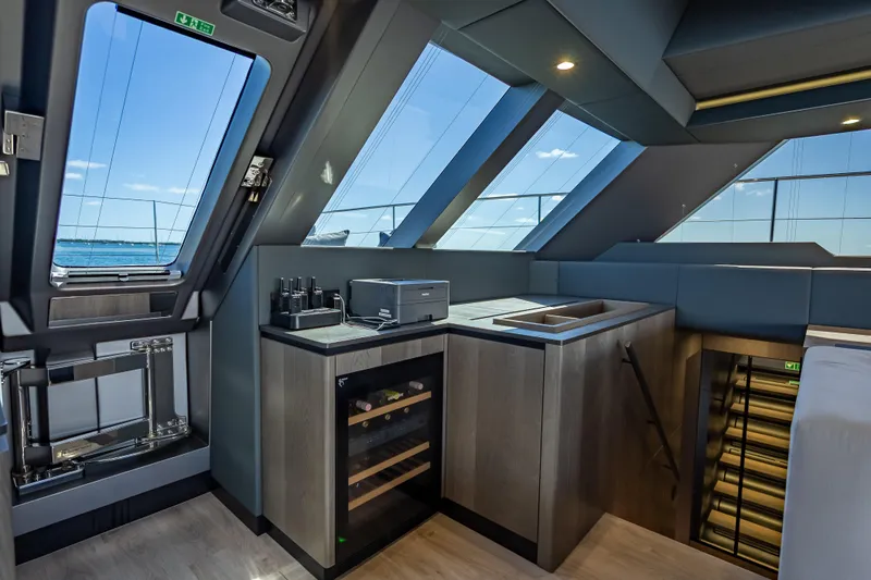 Slide: The Image of Luxurious interior of 2026 Sunreef 60 Power yacht with modern kitchen and panoramic windows. - 60