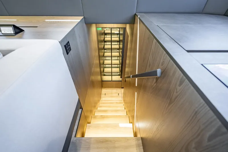 Slide: The Image of Modern interior staircase on 2026 Sunreef 60 Power yacht, featuring sleek wooden design. - 61