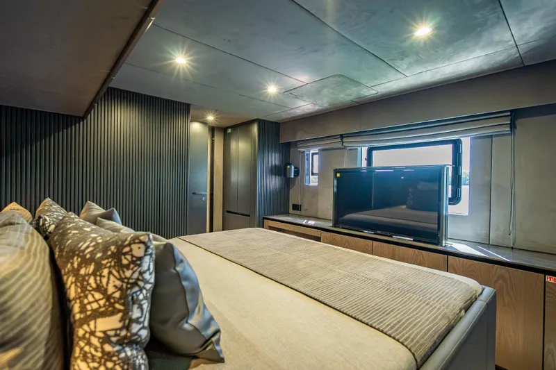 Slide: The Image of Luxurious Sunreef 60 Power 2026 yacht bedroom with modern decor and large window. - 63