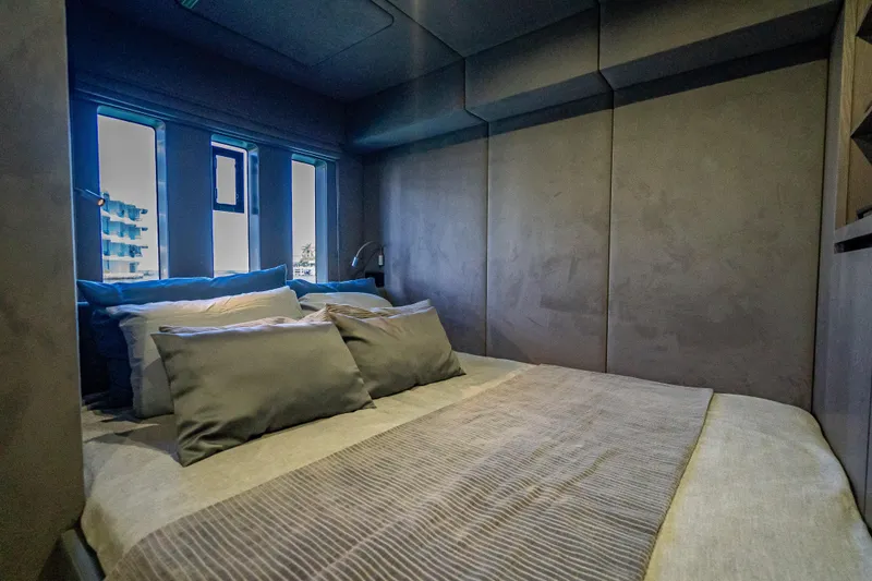 Slide: The Image of Luxurious bedroom interior of 2026 Sunreef 60 Power yacht with modern design and plush bedding. - 71