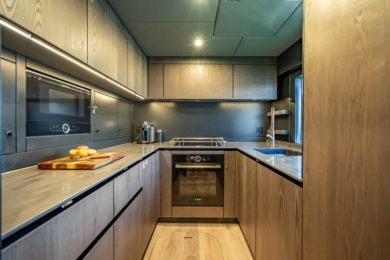 Slide: The Image of Modern kitchen interior on 2026 Sunreef 60 Power yacht, featuring sleek cabinetry and appliances. - 78