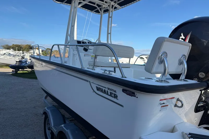 Slide: The Image of 2021 Boston Whaler 190 Montauk boat on trailer, side view, sunny day. - 7