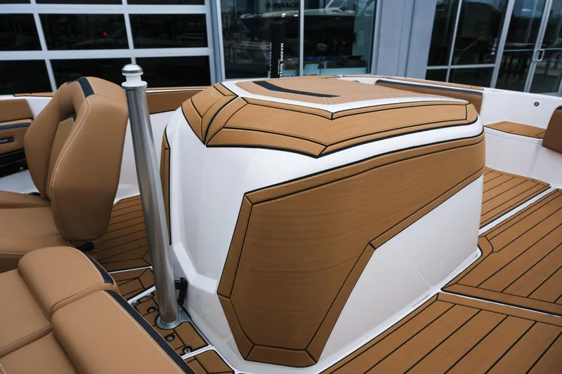 Slide: The Image of 2026 MasterCraft ProStar 190 interior with tan and white upholstery, modern design. - 10