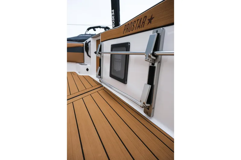 Slide: The Image of 2026 MasterCraft ProStar 190 boat interior with teak flooring and sleek design. - 11