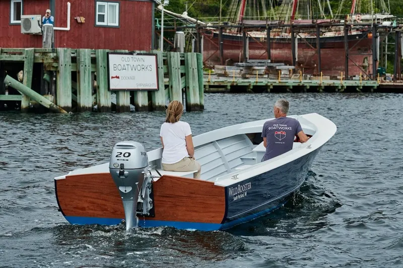 The Image of Custom 2023 Uffa Fox boat on water near Old Town Boatworks dock. - 0